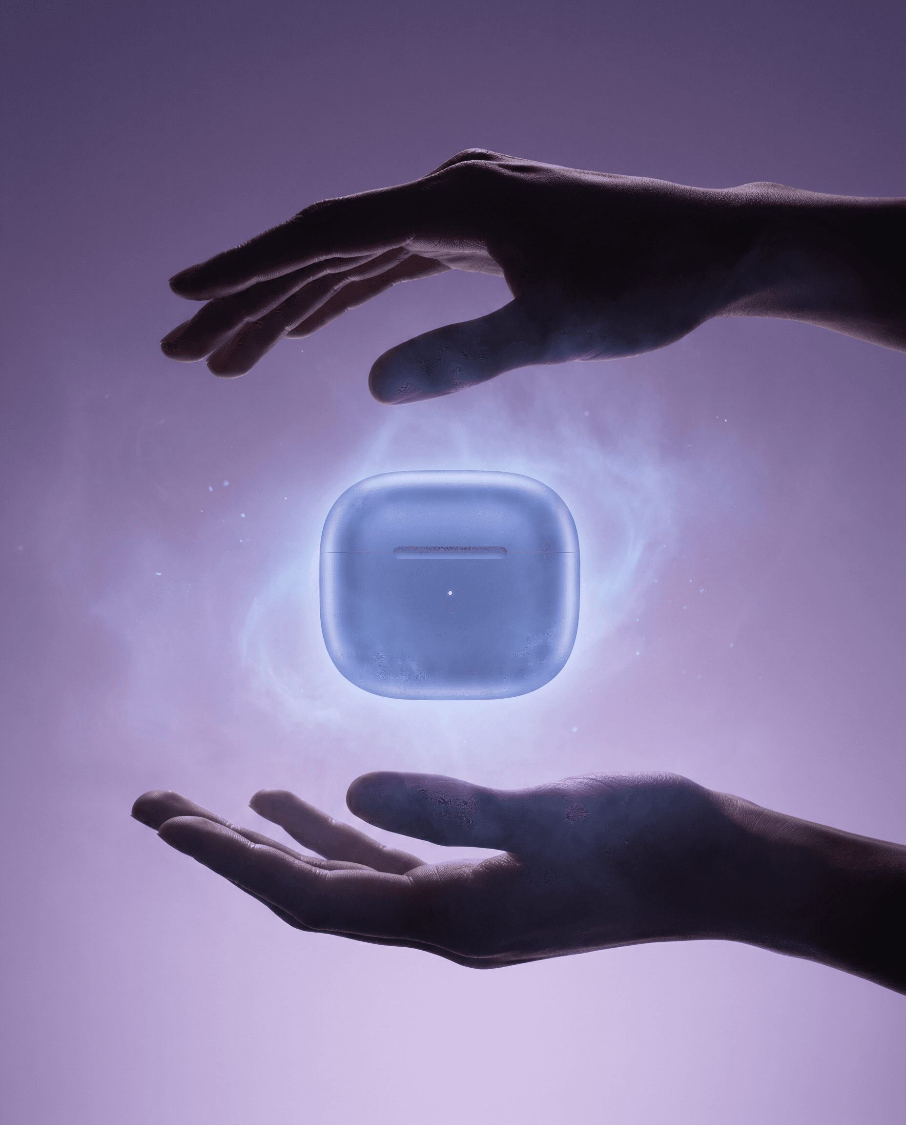 Ethereal levitation editorial, periwinkle blue wireless earbuds case floating suspended between two silhouetted hands on a dreamy lavender-to-purple gradient background, soft volumetric glow surrounding the product, the silhouetted hands creating a reverent gesture as if offering something precious, futuristic aspirational tech photography with an otherworldly magical quality