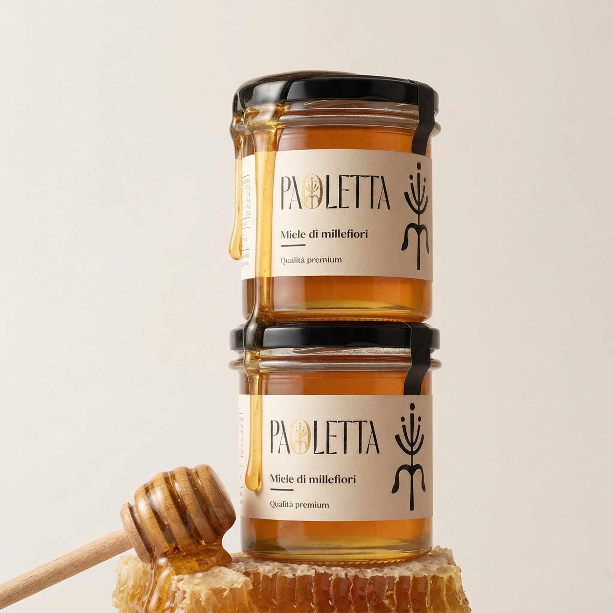 The image is a clean, ingredient-forward skincare still life with a warm, artisanal feel.
Two translucent jars of honey salve are stacked neatly against a soft, neutral background. Thick honey drips slowly from the lid of the top jar and from a wooden honey dipper resting beside the base, creating a sense of richness, viscosity, and indulgence frozen in time.
A raw chunk of honeycomb sits nearby, reinforcing the product’s natural origin and tactile quality. The color palette is restrained and harmonious—milky whites, warm ambers, and soft golds—allowing the textures of glass, honey, and wood to take visual priority.
Lighting is soft and diffused, with gentle highlights that make the honey glow without feeling glossy or artificial. Shadows are minimal, keeping the composition calm and balanced.
Overall, the image feels warm, nourishing, and thoughtfully crafted, blending clinical clarity with natural abundance. It communicates hydration, repair, and ingredient honesty through material and texture rather than overt styling or excess.
